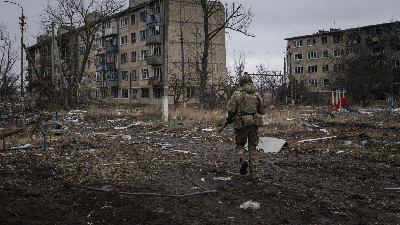 a soldier in a destroyed Ukrainian city